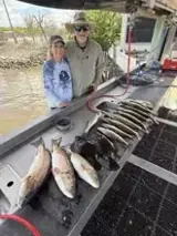 Photo attached to Wendy’s review: two clients with their catch at the dock